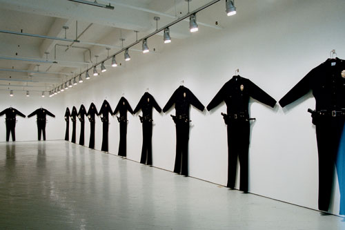 Chris Burden. L.A.P.D. Uniforms, 1993. Wool serge, metal, leather, wood, plastic, 88 × 72 × 6 in (223.5 × 182.8 × 15.2 cm) each. Collection: Marion Boulton Stroud, Philadelphia; and Collection: Fabric Workshop and Museum, Philadelphia. Photograph courtesy of Fabric Workshop.