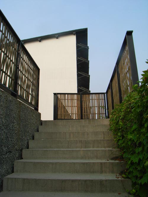 Entrance to the building compound courtyard. Note the use of simple, low-cost materials in a very controlled and texturised manner.