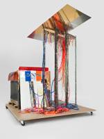 Isa Genzken. Disco Soon (Ground Zero), 2008. Synthetic polymer paint on plastic, cardboard, mirror, spray paint, metal, fabric, hose lights, mirror foil, printed sticker, wood blocks, fiberboard, and casters, 219 x 205 x 165 cm. Carlos and Rosa de la Cruz Collection. Courtesy the artist and Galerie Buchholz, Cologne/Berlin. © Isa Genzken