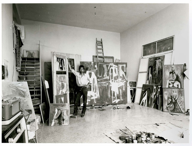 Wifredo Lam in his studio in Albissola in 1964. In the centre is The Soulless Children, 1964. Wifredo Lam Archives. © SDO Wifredo Lam.