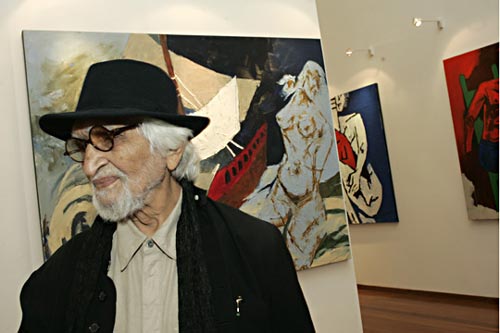 MF Husain in front of painting depicting Ocean Queen Rocks the Ship