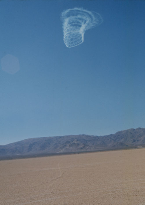 Dennis Oppenheim. Whirlpool - Eye of the Storm, 1973. ¾ mile by 4 mile schemata of a vortex (whirlpool), traced in the sky using standard white smoke discharged by an aircraft over El Mirage Dry Lake, Southern California. © Dennis Oppenheim.