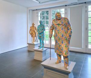 Decolonised Structures (Sir Winston Churchill in foreground), Installation view, Yinka Shonibare CBE: Suspended States, Serpentine South, 2024. © Yinka Shonibare CBE 2024. Photo: © Jo Underhill. Courtesy Yinka Shonibare CBE and Serpentine.