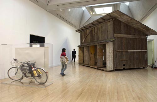 Simon Starling.<em> Shedboatshed</em> <em>(Mobile Architecture No.2)</em>, 2005. Mixed media Kunstmuseum Basel. <em>Tabernas Desert Run,</em> 2004. Fuel cell powered bicycle, watercolour and Perspex vitrine Glasgow City Council (Museums), Gallery of Modern Art, bought with the assistance of the National Art Collections Fund.