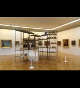 Joseph Beuys. Wirtschaftswerte (Economic Values), 1980. Iron shelves with basic food and tools from East Germany; plaster block with pencil and fat; paintings from the collection of the host museum. Shelves: 290 × 400 × 265 cm; Plaster block: 98.5 × 55.5 × 77.5 cm. Collection of S.M.A.K. Stedelijk Museum voor Actuele Kunst, Ghent, Belgium. Installation view, MANIFESTA 10, Winter Palace, State Hermitage Museum.