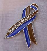 Tania Bruguera. Awareness Ribbon for Immigrant Respect Campaign, 2011.  Awareness campaign. Metal pins, community meetings, letters sent to elected officials, media. Photograph: Camilo Godoy Courtesy of Immigrant Movement International (web).