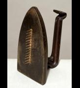 Man Ray. <em>Cadeau,</em> 1921. Iron and nails. Tate. Presented by the Tate Collectors Forum 2002 © Man Ray Trust/ADAGP, Paris and DACS, London 2008