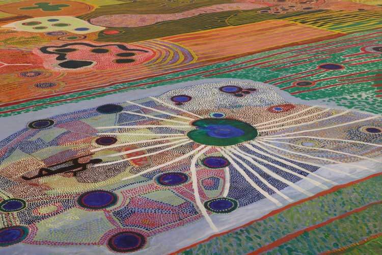 Foreground: Ngurrara Artists, Ngurrara Canvas II, 1997 (detail). Courtesy of the artists and the Ngurrara Canvas Management Group (NCMG) © Ngurrara Artists. Installation view, 25th Biennale of Sydney, Rememory, 2026, Art Gallery of New South Wales. Photo © Art Gallery of New South Wales, Felicity Jenkins.