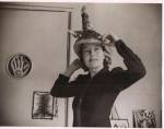 Photograph of Agar wearing Ceremonial Hat for Eating Bouillabaisse, 1936. Private Collection © Estate of Eileen Agar/Bridgeman Images.