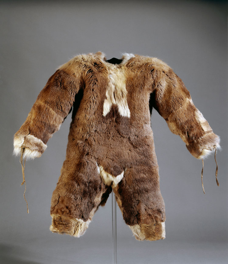 Child’s all-in-one suit made of caribou fur. Inuit, Igloolik, Nunavut, Canada. 1980s. © Trustees of the British Museum.
