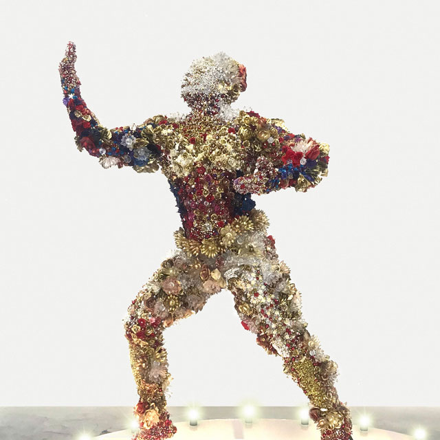 Athi-Patra Ruga. The Proposed Model of Francois Benga (1906-1957), 2018. Sculpture: High-density foam, artificial flowers and jewels; plinth: Wood, perspex and light bulbs, approx 280 x 180 x 100 cm. Multiple of 3. Image courtesy of Athi-Patra Ruga and WHATIFTHEWORLD.
