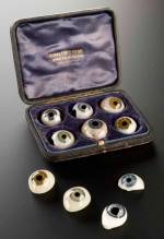R for RESOURCEFULNESS. A case of false eyes. White glass with blood vessels in red and a variety of coloured lenses. Made by W. Halford of London. English, c1890 © Science Museum/Wellcome Library.