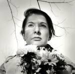 Marina Abramović. <em>Portrait with Flowers</em>, 2009. Black-and-white gelatin silver print; photo: Marco Anelli.