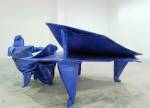 Matt Johnson. <em>The Pianist (after Robert J. Lang)</em> 2005. Blue tarp, paper, stainless stee,l 147x 340 x 198cm. Courtesy of the Saatchi Gallery, London. ©Matt Johnson, 2009.