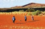 Nyukana Baker, Ungakini Tjangala and Tjariya (Nungalka) Stanley (left to right) at Womikata, near Ernabella, May 2004. Photo: Beth Sometimes.