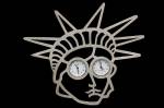   Gijs Bakker, Netherlands. <em>Liberty Brooch</em> 1997. Sterling silver 925, stainless-steel watches. 4.2 x 3.6 inches.  Photo: John Bigelow Taylor.