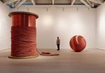 Alice Anderson. Left: Bound, 2011. Bobbin made of wood and copper thread, 345 x 248 x 248 cm. Right: 181 Kilometers, 2015. Sculpture made after performances, copper thread 200 cm (diameter). Photograph © Steve White, 2015. Courtesy of the Saatchi Gallery, London.