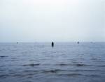 Antony Gormley. <em>Another Place</em>, 1997. Cast iron, 189 x 53 x 29 cm (100 elements). Installation view, Cuxhaven, Germany. © Antony Gormley. Photograph by Helmut Kunde.