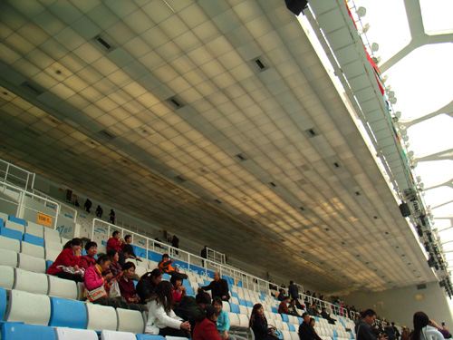 The audience seating and the translucent roof over them.