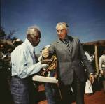 <p>Mervyn Bishop. <em>Prime Minister Gough Witlam pours soil into the hands of traditional land owner Vincent Lingiari, Northern Territory 1975</em>, 1999. Type R3 photograph, 30.5 x 30.5 cm.