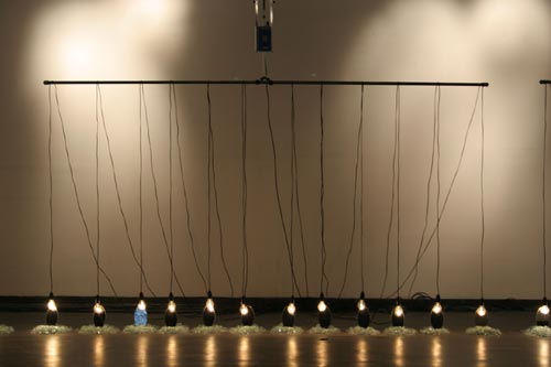 Suzann Victor. <em>Expense of Spirit in a Waste of Shame </em>2002. Light bulbs, mirrors, cables, mechanical rockers, control unit, broken glass.