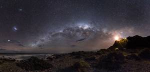 EARTH AND SPACE. Winner and Overall Winner: Mark Gee (Australia), Guiding Light to the Stars. The skies of the Southern Hemisphere offer a rich variety of astronomical highlights. The central regions of the Milky Way Galaxy, 26,000 light years away, appear as a tangle of dust and stars in the central part of the image. Two even more distant objects are visible as smudges of light in the upper left of the picture. These are the Magellanic Clouds, two small satellite galaxies in orbit around the Milky Way. © Mark Gee.