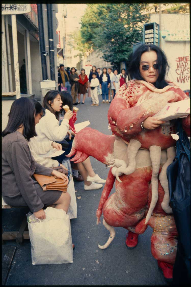 Lee Bul. Sorry for suffering—You think I'm a puppy on a picnic? 1990. Performance still, 12-day performance, Gimpo Airport, Korea; Narita Airport, Japan; downtown Tokyo; Tokiwaza Theater, Tokyo. © Lee Bul. Courtesy of the artist.