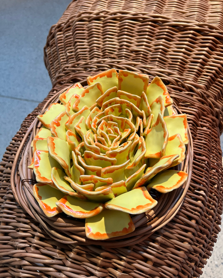 Ceramic hop flower on coffin lid. Installation view, Jonathan Baldock, Touch Wood, Yorkshire Sculpture Park, 2023. Photo: Veronica Simpson.