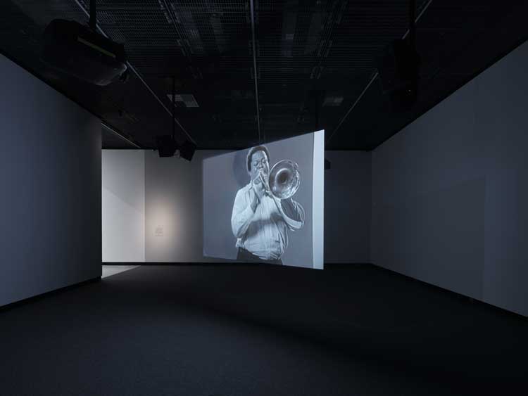 Installation view of Bohemia: History of an Idea 1950-2000, Kunsthalle Praha. Auditorium featuring Stan Douglas, Hors-champs, 1992. Two-channel black-and-white video installation, stereo sound. Courtesy of the artist, Victoria Miro and David Zwirner.