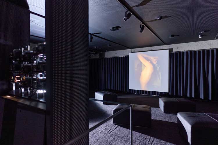 Installation view of Bohemia: History of an Idea 1950-2000, Kunsthalle Praha. Black Box featuring Nan Goldin, The Ballad of Sexual Dependency, 1979/2001, edition 7 of 10. Multimedia installation (720 colour slides and programmed soundtrack). The Art Institute of Chicago (through prior bequest of Marguerita S. Ritman; purchased with funds provided by Dorie Sternberg, the Photography Associates, Mary L. and Leigh B. Block Endowment, Robert and Joan Feitler, Anstiss and Ronald Krueck, Karen and Jim Frank, Martin and Danielle Zimmerman).