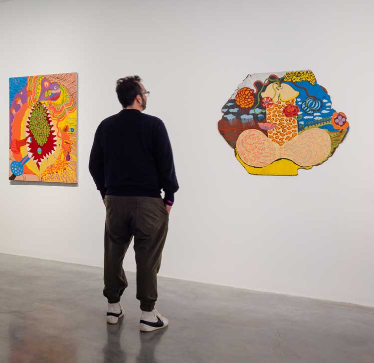 Right: Vivienne Binns, Phallic Monument, 1966. Synthetic polymer paint on composition board, 91.5 x 106 cm.  Installation view, On and through the Surface, Museum of Contemporary Art Australia, Sydney, image courtesy the artist, National Gallery of Australia, and Museum of Contemporary Art Australia © the artist. Photo: Jacquie Manning.