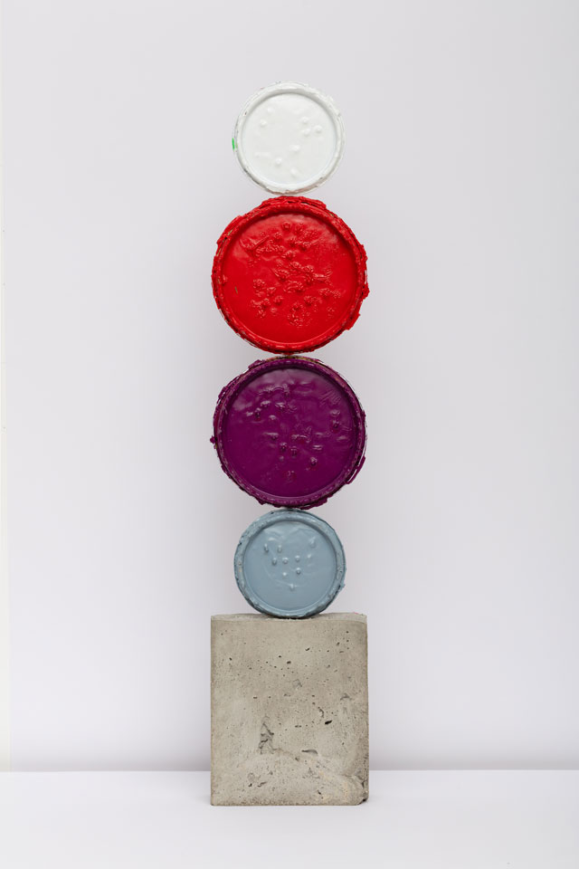 David Batchelor. Geo-Concreto 12, 2018. Tin lids, gloss paint and concrete, 70 x 15 x 5 cm. Photo: Lucy Dawkins. Courtesy of the Artist and Ingleby, Edinburgh.