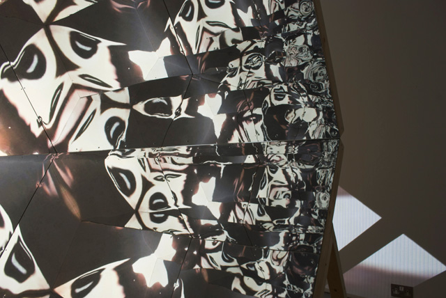 Laura Buckley. Fata Morgana, 2012. Sculpture: mixed media, mirrored acrylic, plywood, tinder, projection fabric; Film: digital video duration 8:18 min, 480 x 290 x 242 cm. © Laura Buckley, 2012. Image courtesy of Saatchi Gallery, London.