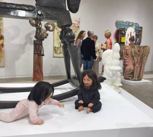 John Waters, Playdate, 2006 (foreground). Silicone sculpture of Michael Jackson and Charles Manson. Installation view, The Bunker Artspace, West Palm Beach, Florida. Photo: Jill Spalding.