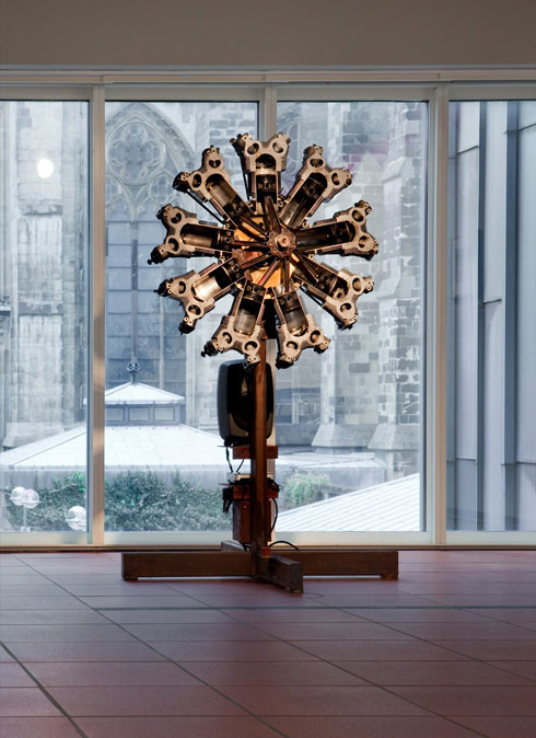 Thomas Bayrle. Monstrance, 2010. Radial engine, electric drive, and sound; sound collage: Rosary (German) and radial engine, 9 x 43 1/4 x 47 1/4 in (150 x 110 x 120 cm). Photograph: Nikolaus Schletterer.