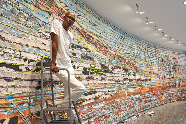 Mark Bradford at the Hirshhorn Museum and Sculpture Garden with details of Pickett’s Charge, 2017. Courtesy of the artist and Hauser & Wirth. Photograph: Cathy Carver.