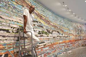 Mark Bradford at the Hirshhorn Museum and Sculpture Garden with details of Pickett’s Charge, 2017. Courtesy of the artist and Hauser & Wirth. Photograph: Cathy Carver.