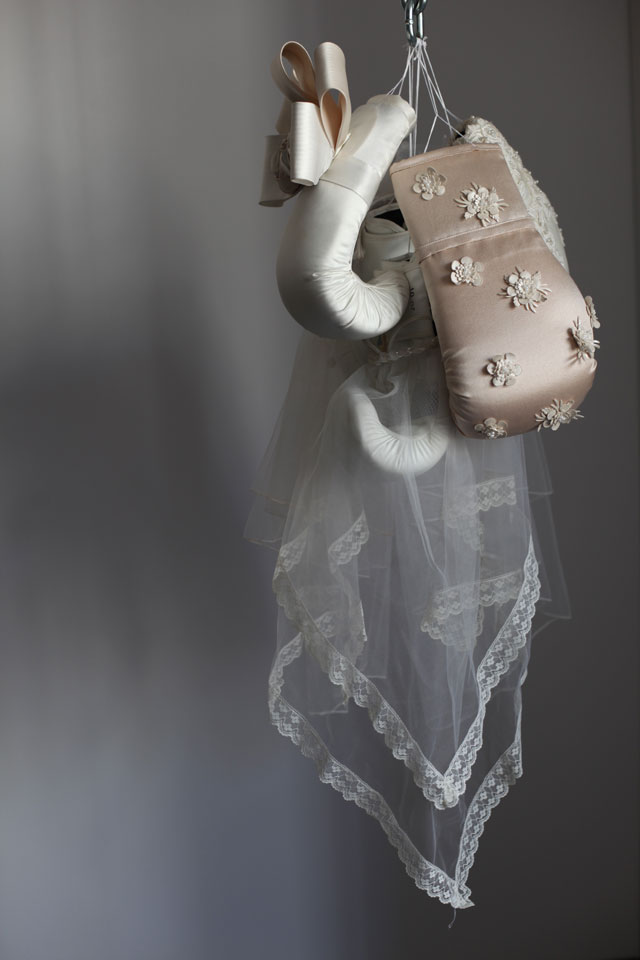 Zoe Buckman. Ode On, 2016. Chain, boxing gloves and embroidery on vintage wedding dresses, 41 x 16 x 17 in. Courtesy the artist and 21c Museum.