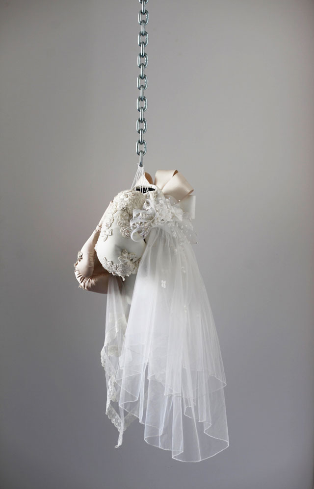 Zoe Buckman. Ode On, 2016. Chain, boxing gloves and embroidery on vintage wedding dresses, 41 x 16 x 17 in. Courtesy the artist and 21c Museum.