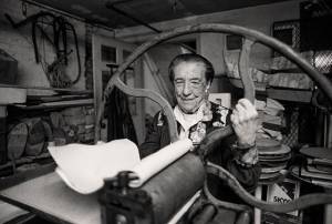 Louise Bourgeois at the printing press in the lower level of her home/studio on 20th Street, New York, 1995. Photograph by and © Mathias Johansson.