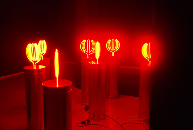 Mahmoud Bakhshi. Tulips Rise from the Blood of the Nation Youth, Industrial Revolution Series, 2008. Neon, tinplate, wood, plastic, electric engine, 135 x 35 x 30 cm each sculpture. © Mahmoud Bakhshi.