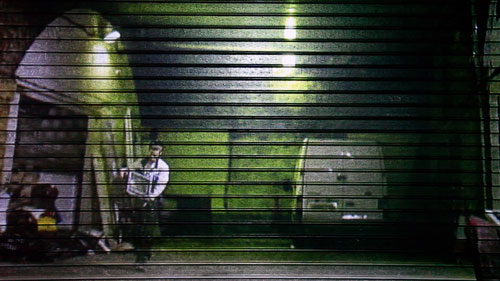 Toby Ross-Southall. Self-Effacement II (Bonny Street) (Installation View), 2010. DVD loop, projection, corrugated iron shutter, dimensions variable. © the artist.