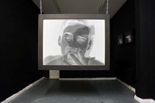 Toby Ross-Southall. Empirical Provocations, (Installation View), 2010. 144 slides, slide projectors, chain, rear projection PVC screen mounted in box frame, dimensions variable. © the artist.