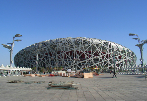 View of the National Stadium from the Olympic Plaza between the Stadium and the National Aquatics Centre.