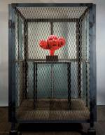Louise Bourgeois. Cell XIV (portrait), 2000. Steel, glass, wood, metal and red fabric, 188 x 121.9 x 121.9 cm. Photograph: Christopher Burke, © The Easton Foundation/Licensed by DACS.