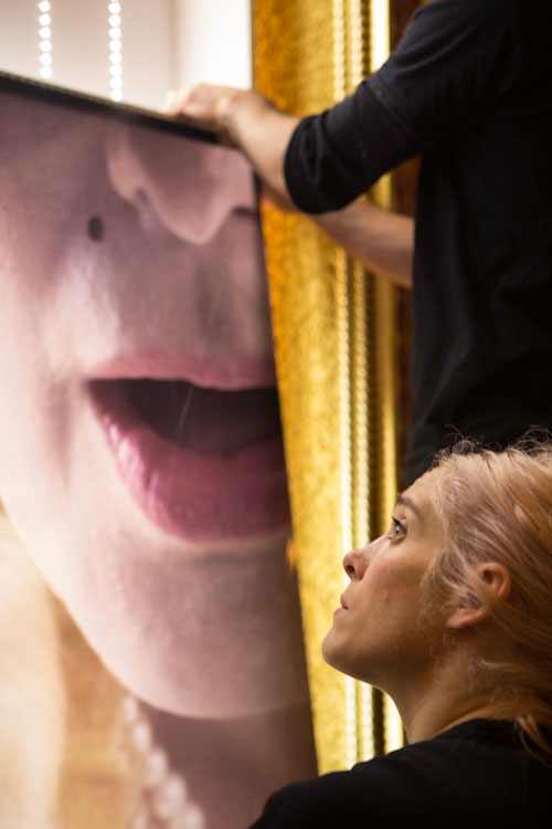 Maisie Broadhead installing her installation Peepers in the Music Room of the Royal Pavilion, Brighton, October 2014 (2). Photograph © Matthew Andrews.