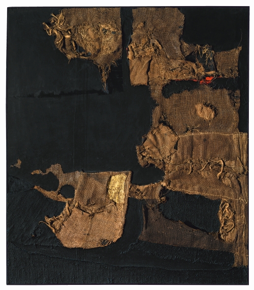 Alberto Burri. Sacco e oro (Sack and Gold), 1953. Burlap, thread, acrylic, gold leaf and PVA on black fabric, 102.9 x 89.4 cm. Private collection, courtesy Galleria dello Scudo, Verona © Fondazione Palazzo Albizzini, Collezione Burri, Città di Castello/2015 Artist Rights Society (ARS), New York/SIAE, Rome.