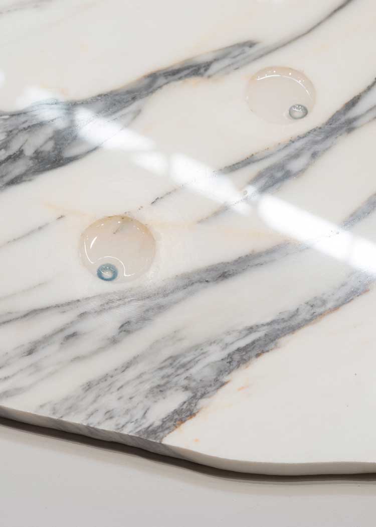 Tania Pérez Córdova, You, Me, Us, You, Them (Tu, yo, nosotrxs, ustedes, ellxs), 2022 (detail). Marble, personalized cosmetic contact lenses, one or more people wearing contact lenses of a colour different from their natural eyes. 1 x 64 x 69 in (2.5 x 163 x 175 cm). Installation view, Tania Pérez Córdova: Generalization, SculptureCenter, New York, 2023. Commissioned by Museo Tamayo, Mexico City. Courtesy the artist and Galerie Art: Concept, Paris. Photo: Charles Benton.