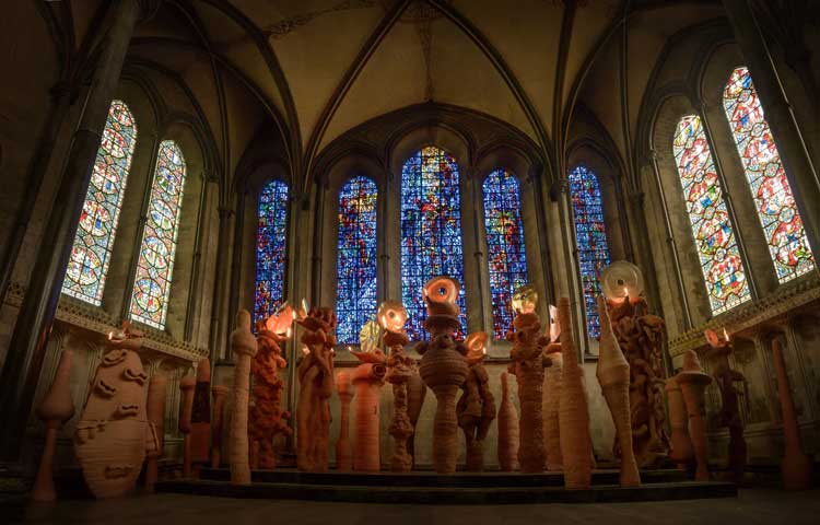 Nicholas Pope, The Apostles Speaking in Tongues Lit by Their Own Lamps, 2014. Terracotta, approx 13.5 x 3.8 m. Courtesy of the artist and The New Art Centre Roche Court. Installation view, Salisbury Cathedral. Photo: Ash Mills.