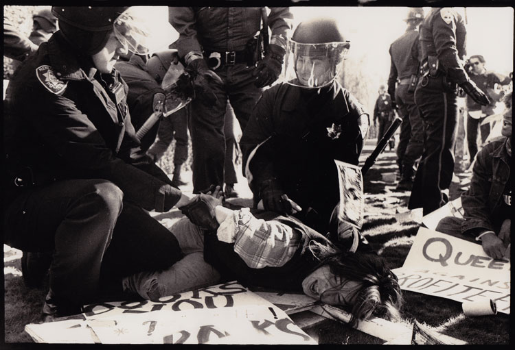 Phyllis Christopher. ACT-UP Protest at Burroughs Welcome Pharmaceutical Company, Livermore, CA, 1989. Silver gelatin print. © Phyllis Christopher.
